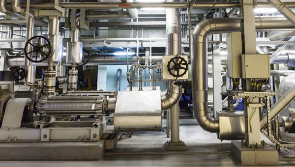 Indoor view of large metal pipes and systems