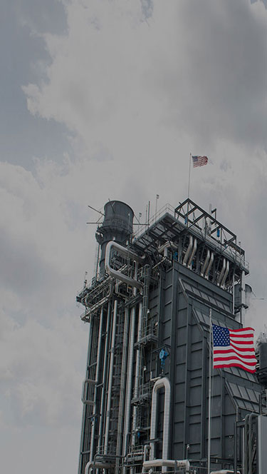 American flag outside a gas project facility
