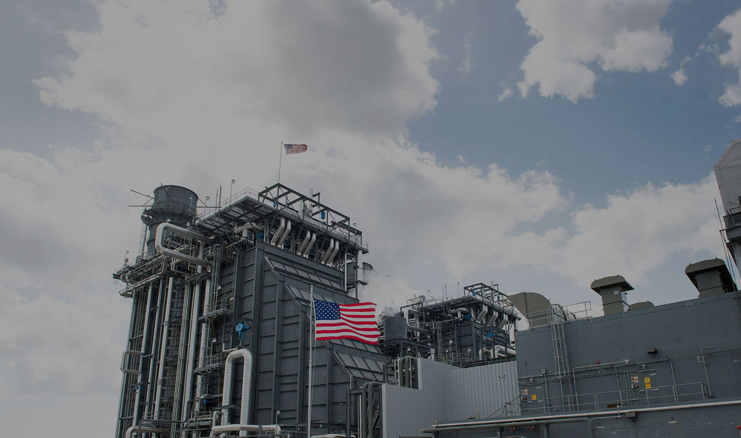 American flag outside a gas project facility 