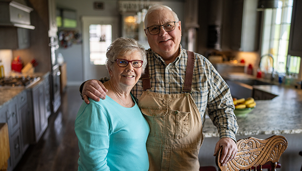 Elderly couple embracing - Partnering with local landowners