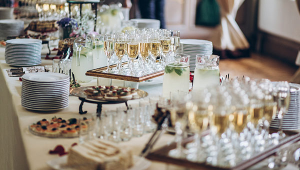 Buffet table with campaign glasses and appetizers