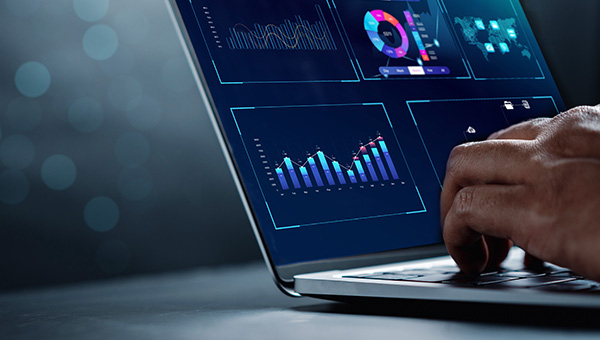 Hands using laptop showing marketing graphs Hands using laptop showing marketing graphs