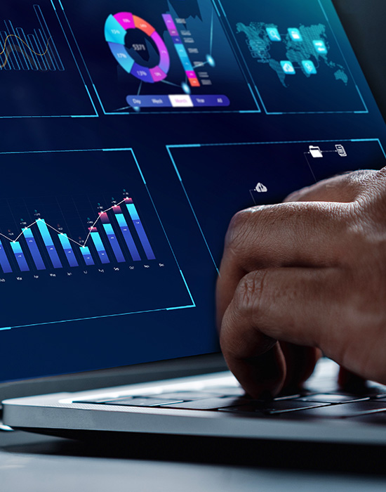 Businessman reviewing analytics data on a laptop