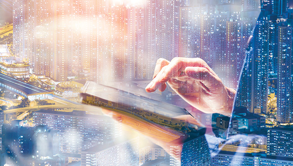 Man holding a tablet with data overlay