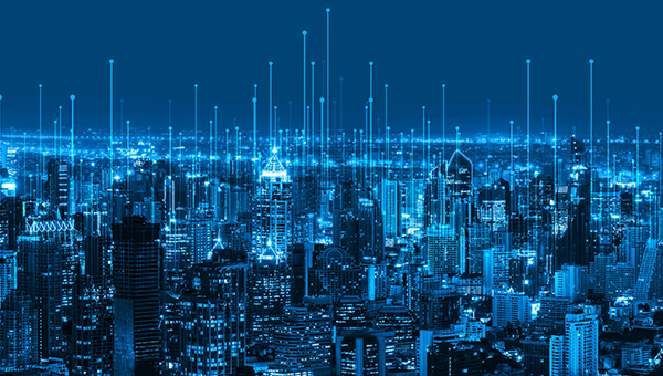 Concept of a smart city connected by data emanating neon blue energy points Concept of a smart city connected by data emanating neon blue energy points