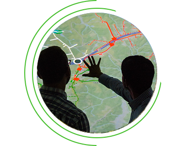 Engineering department researchers study topography of a distribution management system power grid. Engineering department researchers study topography of a distribution management system power grid.