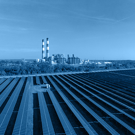 Solar panels and wind turbines with a stock graph overlay Solar panels and wind turbines with a stock graph overlay