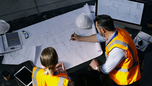 Construction engineers planning the EV site infrastructure design Construction engineers planning the EV site infrastructure design