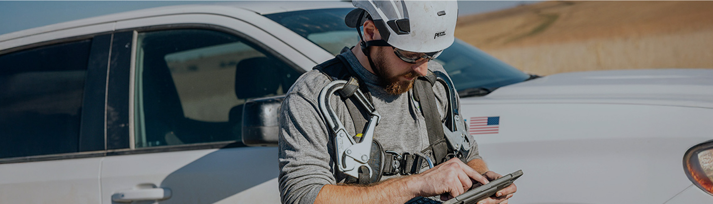 Wind technician reviewing information on a tablet computer