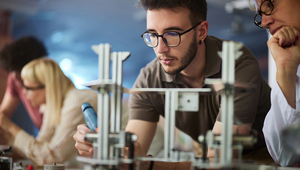 Students in a classroom building models