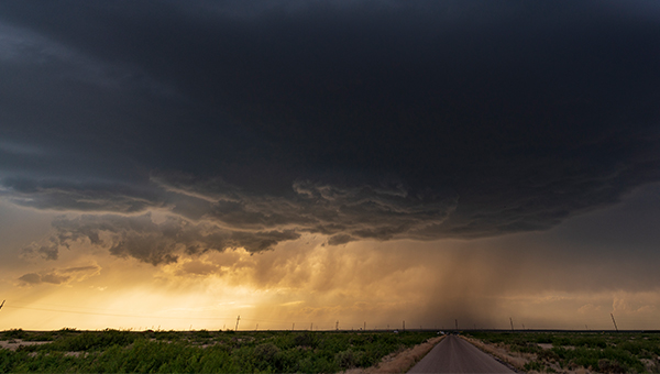 Farm land with a storm brewing over the horizon