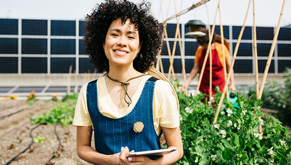 Smiling farmer on her land