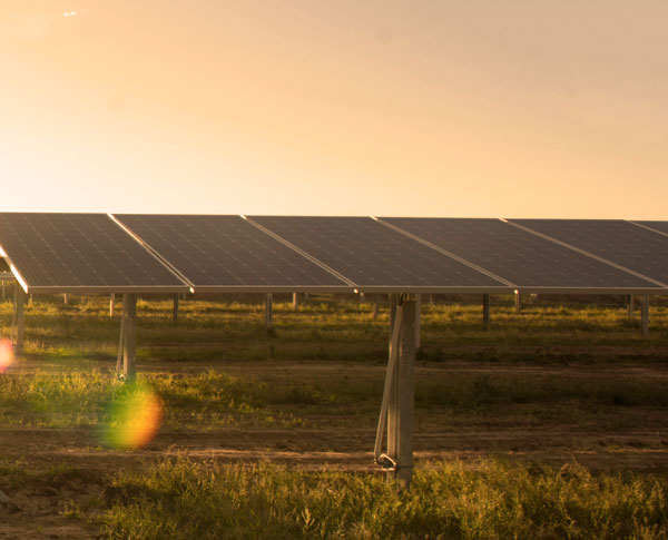 Solar panels under a sunset sky Solar panels under a sunset sky