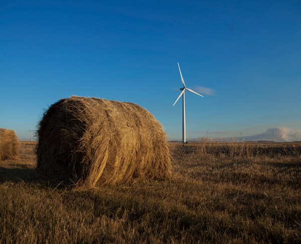 Wind turbine and a hale bale in a dry open field Wind turbine and a hale bale in a dry open field