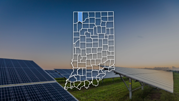 Indiana map outline with county highlighted with an image of solar panels in the background