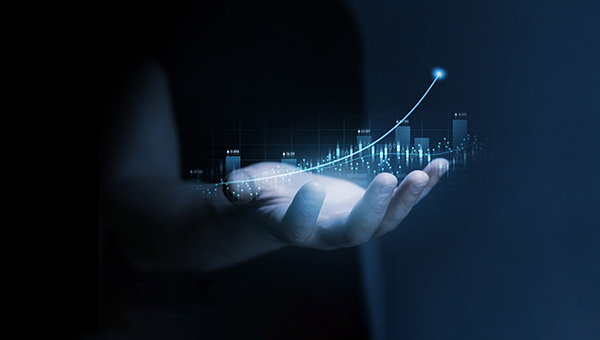 Hand holding a graph that shows increase