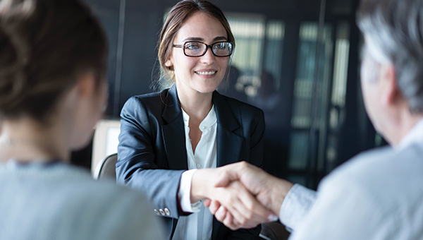 Business people shaking hands in a meeting