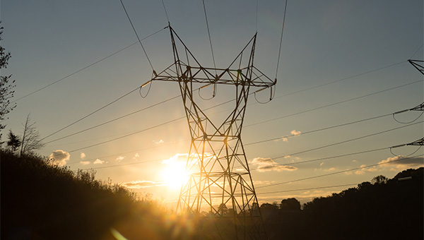 Transmission towers at sunset