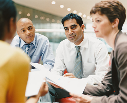 people around a table in a business meeting