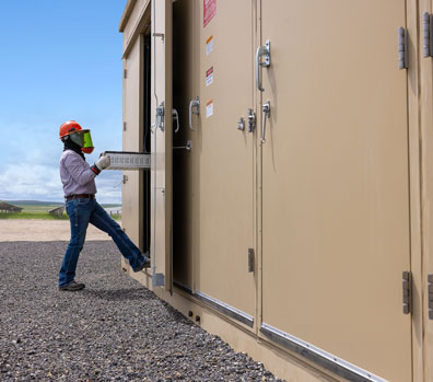 NextEra Energy Resources employee handling at battery.